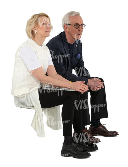 senior man and woman sitting and looking at smth