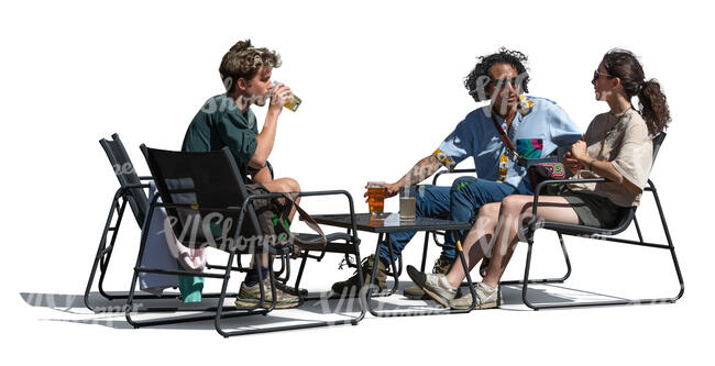 three cut out people sitting in a lounge cafe