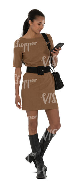 black woman in a brown dress standing