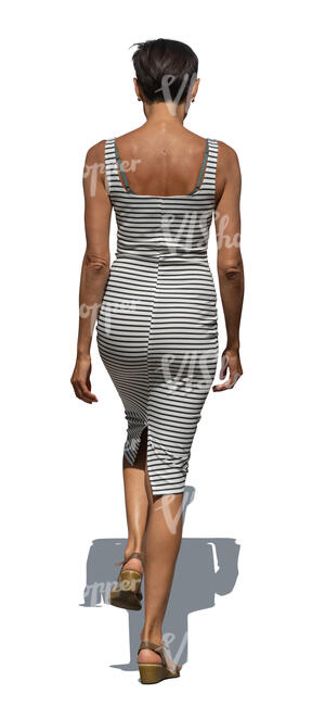 woman in a striped dress walking up the stairs