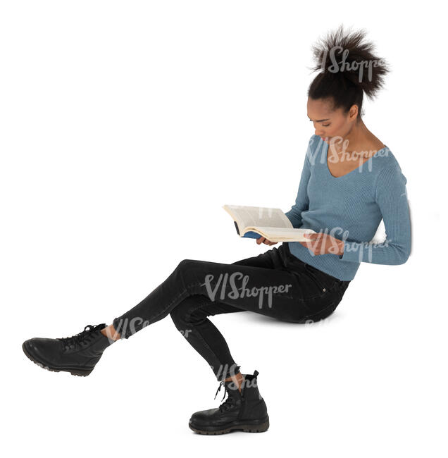 top view of a young black woman sitting and reading a book