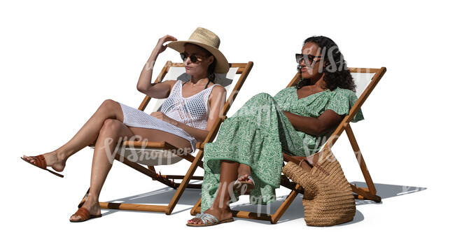 two resort style women relaxing in garden chairs