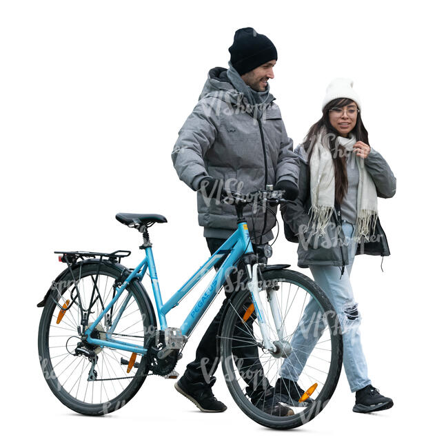 man with a bike walking with a girl in cold weather
