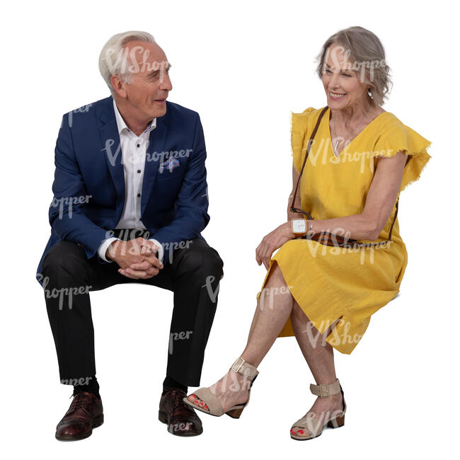 elderly couple at a party sitting and talking