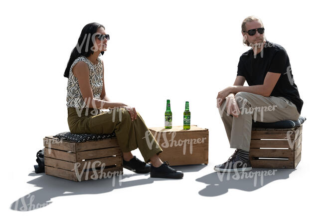 backlit man and woman sitting in a casual hipster cafe