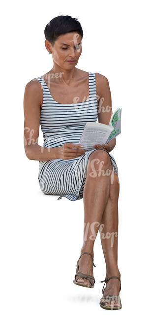 woman in a striped dress sitting and reading a book