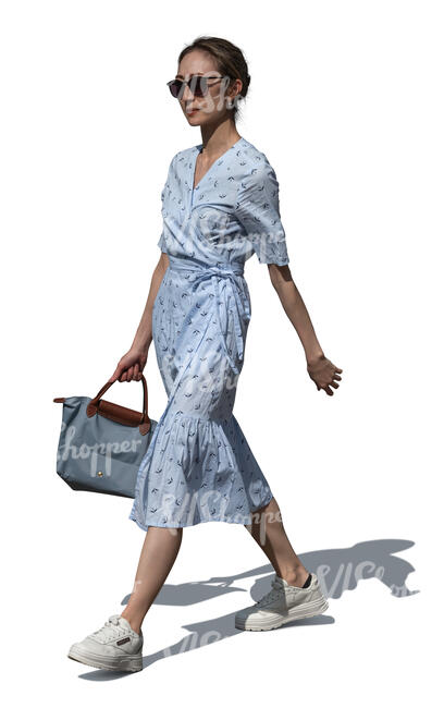 asian woman in a blue dress walking