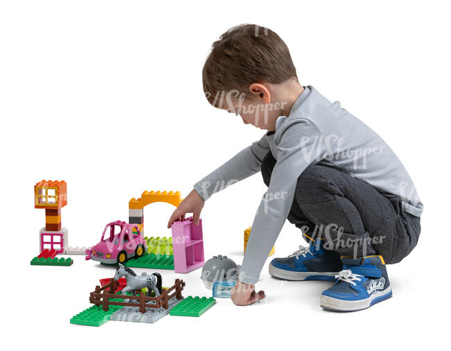cut out little boy playing with toys