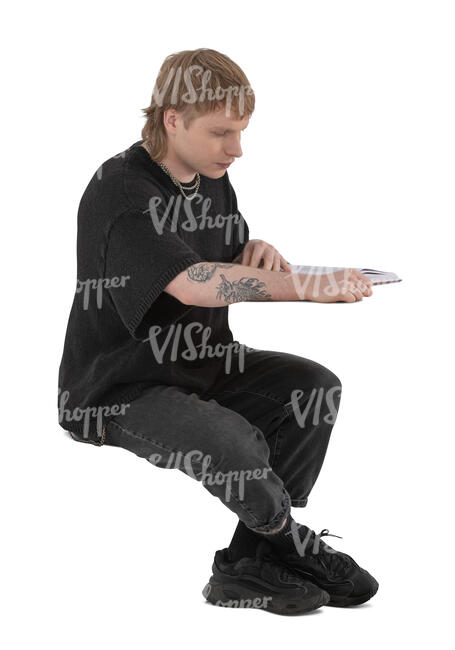 cut out young man sitting and reading a book