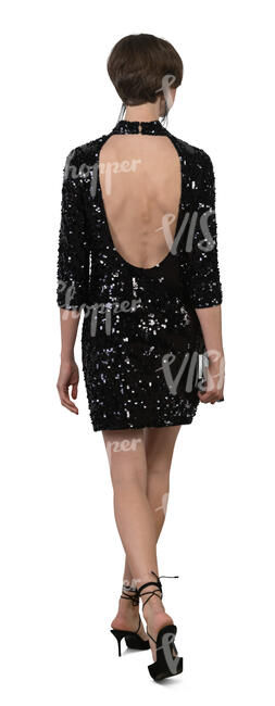 woman in a party dress and wearing high heels walking