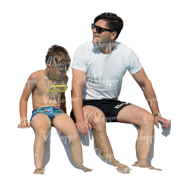 father and son sitting at the edge of the pool