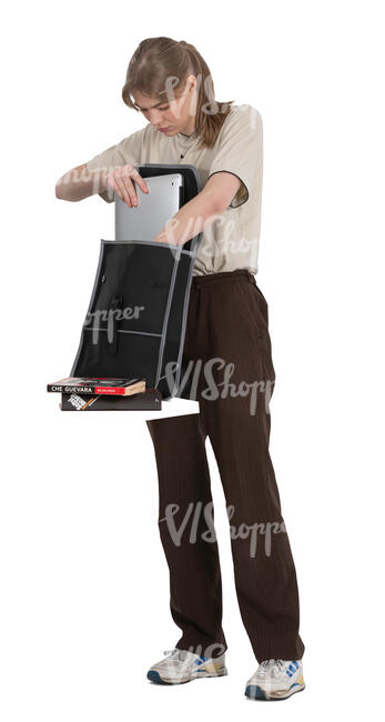 female student taking books out of the backpack