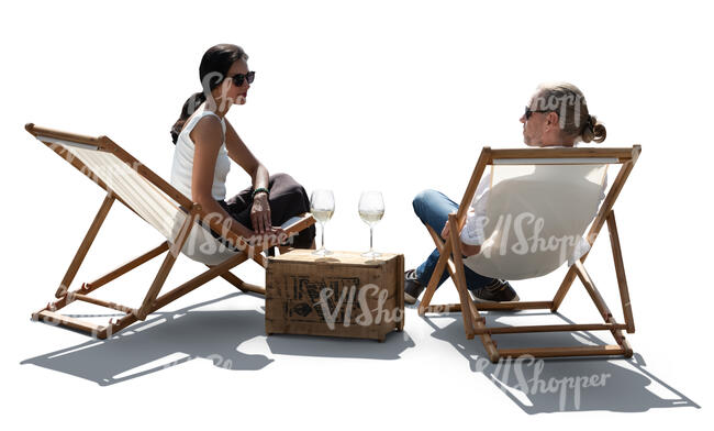 two people sitting on the patio in sling chairs and drinking wine