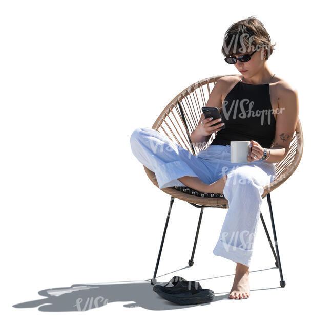 cut out backlit woman sitting in a balcony armchair
