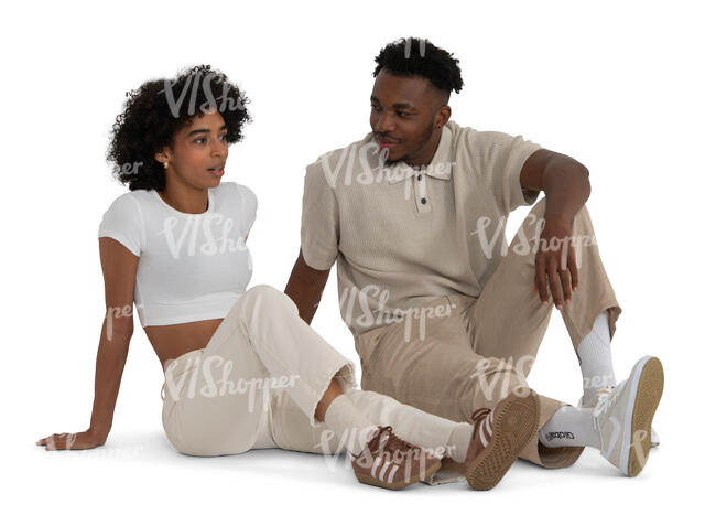 black couple sitting on the ground