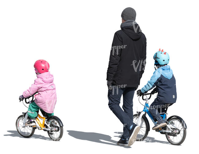 father with two kids on the bikes