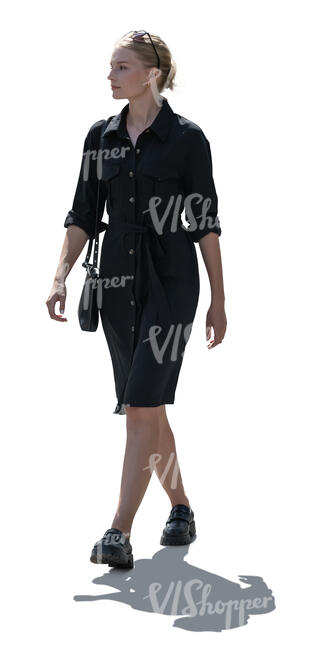 cut out backlit woman in a black dress walking