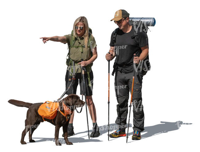 hikers with a dog standing and pointing at smth