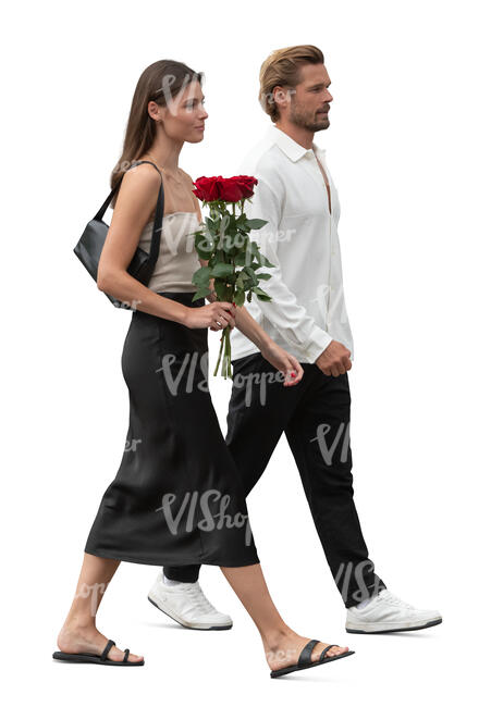 couple with a bouquet of flowers walking