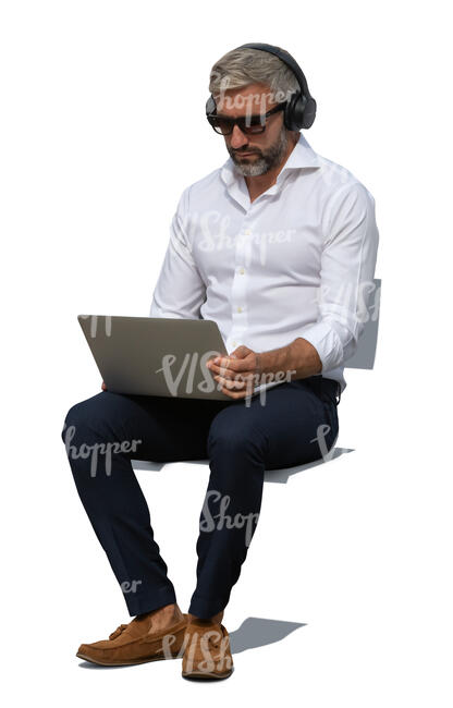cut out man with a laptop sitting outside