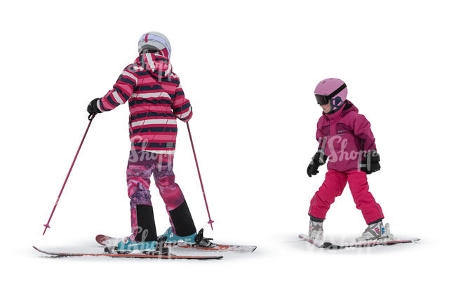 two cut out girls mountain skiing
