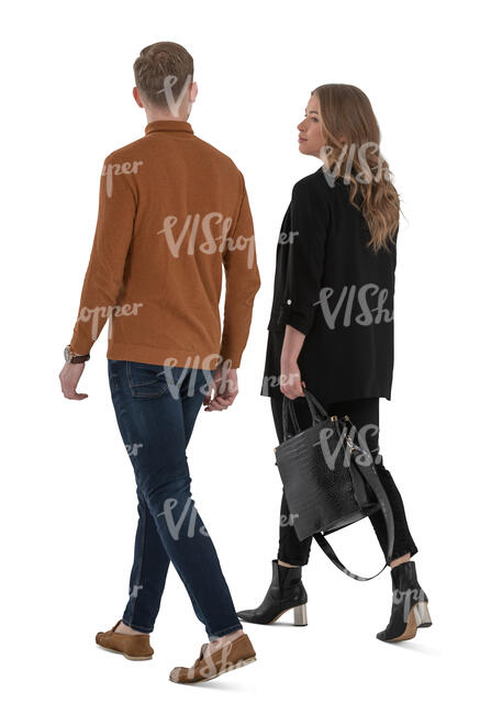 man and woman walking seen from back angle