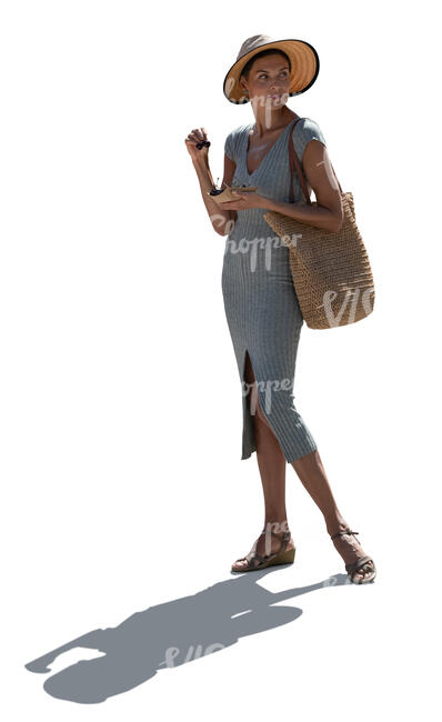 cut out backlit woman in a dress wearing a hat standing