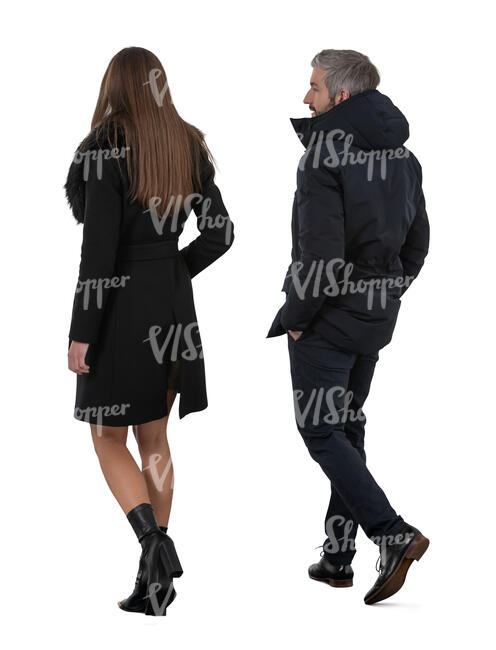 two people in dark winter outfits walking