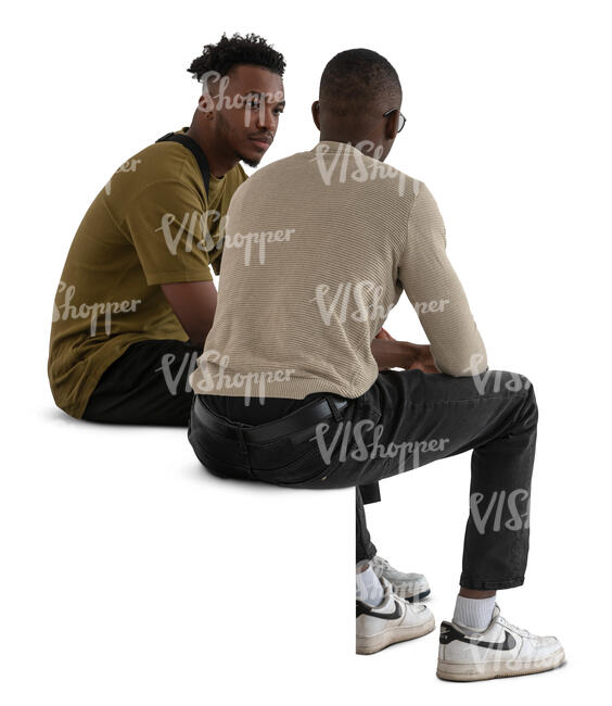 two black men sitting and talking