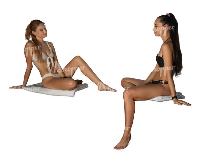 two cut out women in bathing suits sitting in a spa
