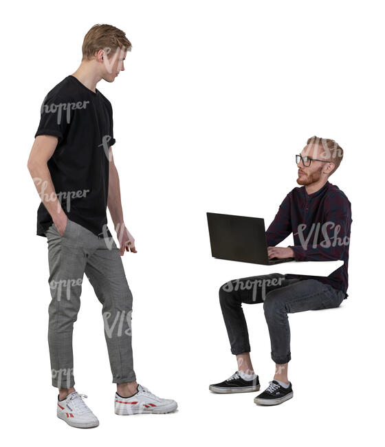 two men talking at the office while one is sitting behind the desk