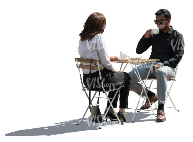 backlit cafe scene with two people drinking coffee