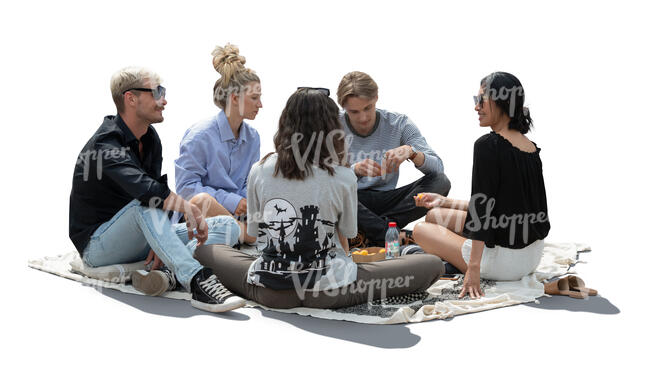 cut out backlit group of people sitting on the ground