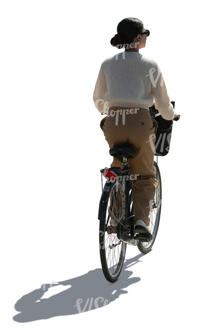 cut out backlit woman riding a bicycle