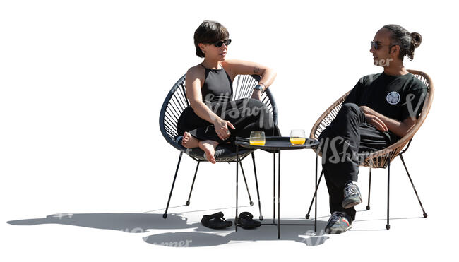 cut out backlit scene of two people sitting on the patio