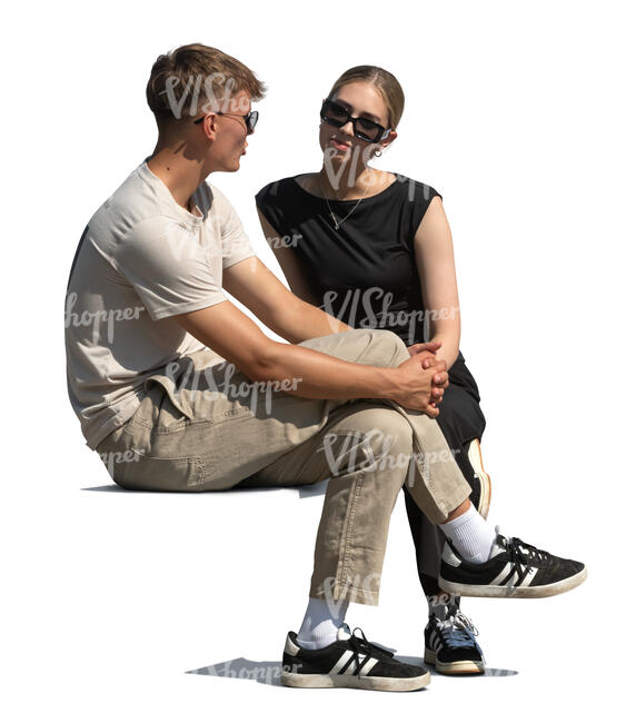 two cut out people sitting and talking