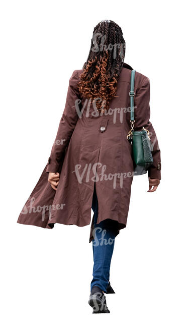 cut out woman in a brown overcoat walking up the stairs