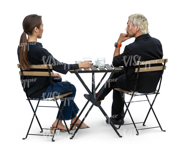 east asian man and woman sitting in a cafe