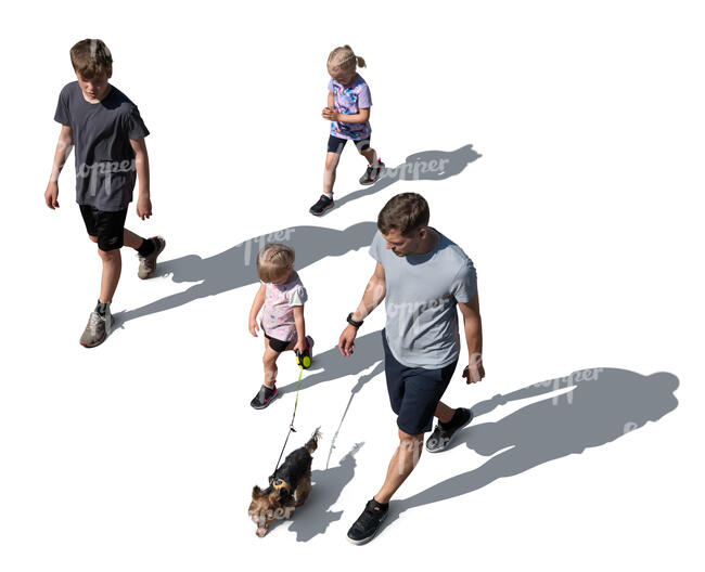 top view of a man with children and a dog walking