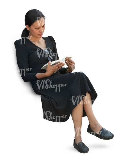 cut out woman sitting and reading seen from above