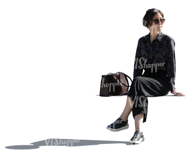 cut out backlit asian woman sitting
