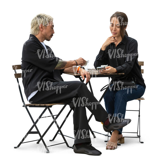 cut out asian man and woman sitting in a cafeteria