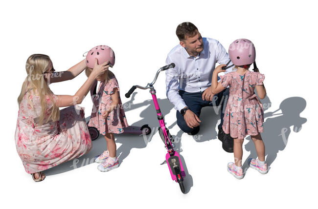 top view of parents helping kids with scooters