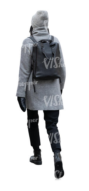 cut out asian woman in a grey winter coat walking