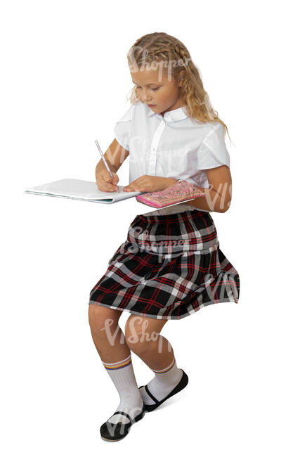 cut out schoolgirl sitting at a desk and writing