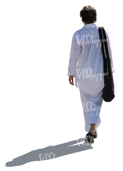 cut out woman in white in backlight walking