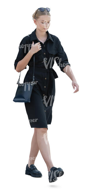 cut out woman in a smart casual black dress walking