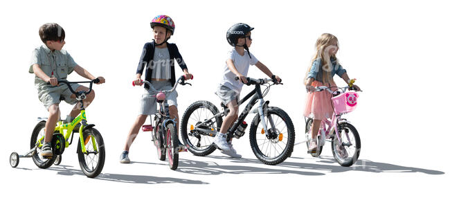 backlit group of little kids with bikes