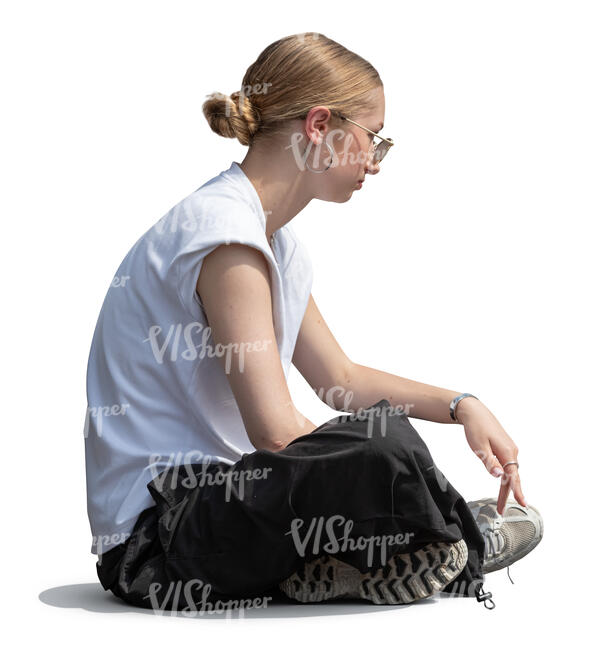 cut out teenage girl sitting on the ground