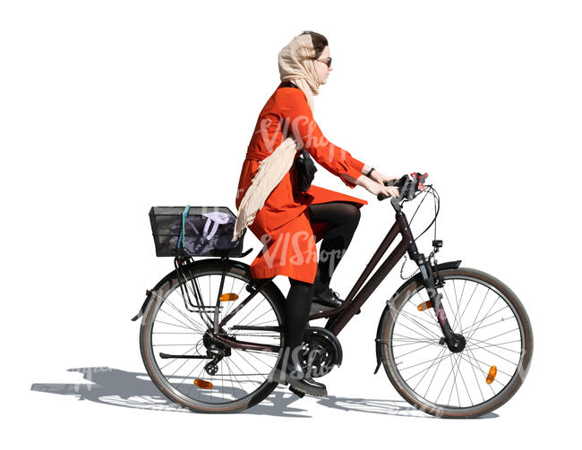 woman in a red overcoat riding a bike
